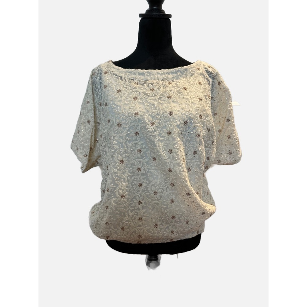 Cream shirt with white embroidery and gold flowers in size medium.